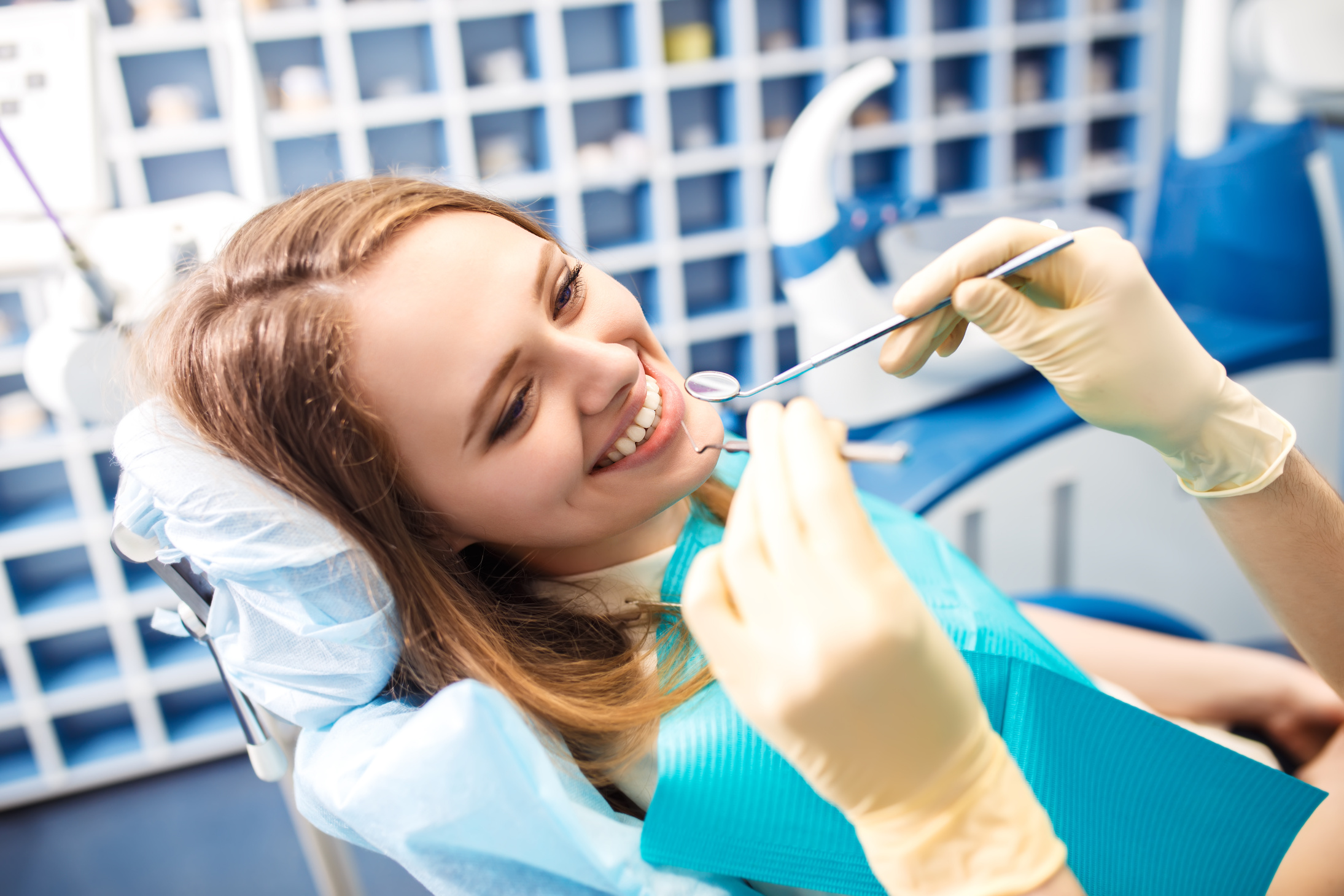 Overview of dental caries prevention. Woman at the dentist's chair during a dental procedure. Healthy Smile.